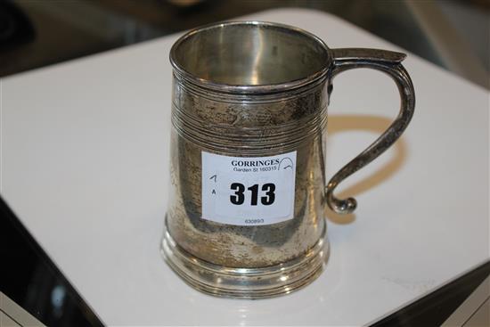 A ring turned silver mug